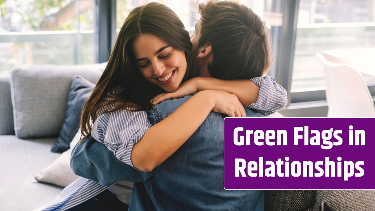 Smiling couple sitting on sofa at home hugging each other happy Concept of love and happiness.