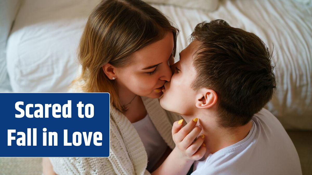 Happy positive young couple hugging and relaxing sitting by couch cheerful loving guy.